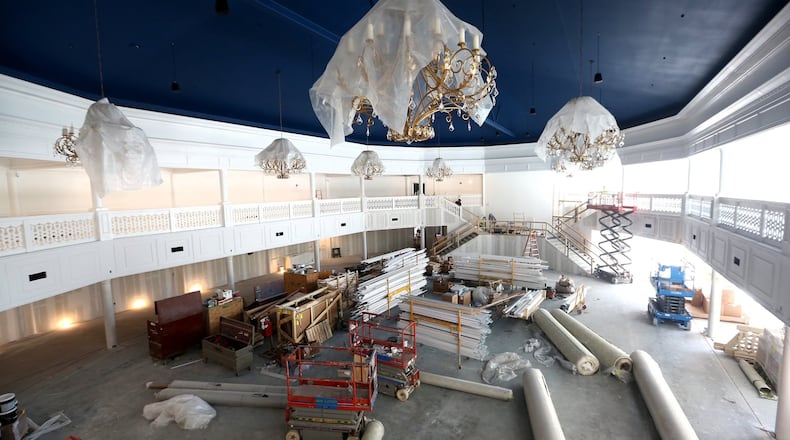 The two-story Eichelberger Pavilion can seat up to 700 people for weddings or corporate events. Brass castings of historic NCR cash registers inspired the patterns in the wall paper, carpet and the railings around the mezzanine. The pavilion is part of the new Winsupply Center of Leadership at Carillon Historical Park. LISA POWELL / STAFF