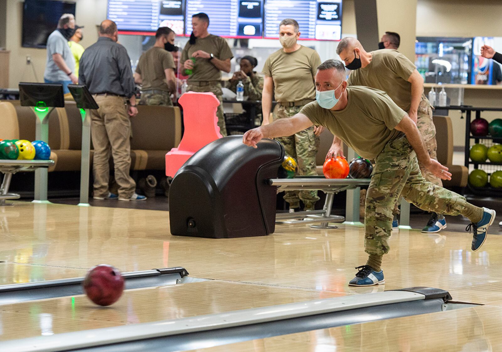 Chief Master Sgt. Keith Erb, Air Force Band of Flight manager, rolls a ball down the lane during the Eagles vs. Chiefs Bowling Challenge. U.S. AIR FORCE PHOTO/FARNSWORTH