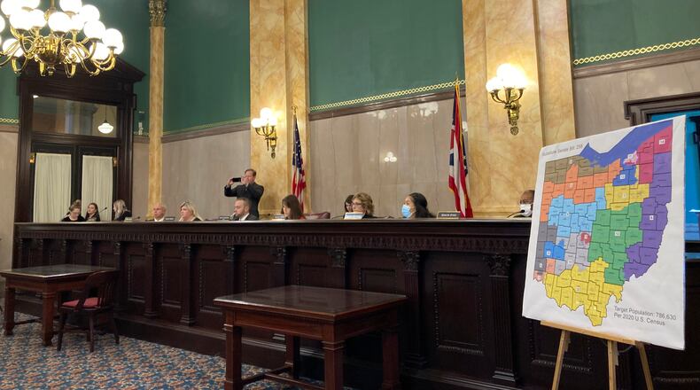 Members of the Ohio Senate Government Oversight Committee hear testimony on a new map of state congressional districts on Tuesday, Nov. 16, 2021, at the Ohio Statehouse in Columbus, Ohio. (AP Photo/Julie Carr Smyth)