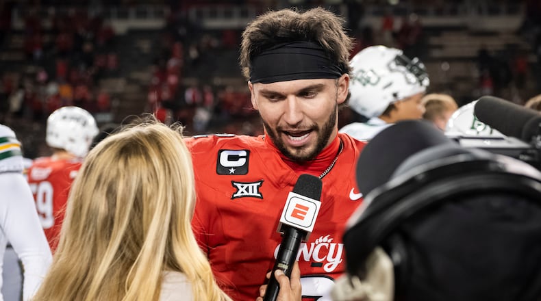 FILE - Cincinnati quarterback Brendan Sorsby (2) is interviewed after a NCAA college football game against Baylor, Saturday, Oct. 25, 2025, in Cincinnati. (AP Photo/Tanner Pearson,File)