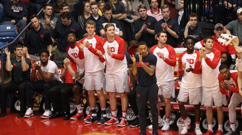 Dayton players, including Josh Cunningham, far left, cheer during a game against Saint Louis on Jan. 22, 2017, at UD Arena.