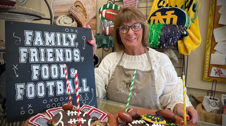 Theresa Hammons, who owns Ashley’s Pastry Shop with her husband, Greg, is preparing for the College Football Playoff championship game with treats honoring both teams. NATALIE JONES/STAFF