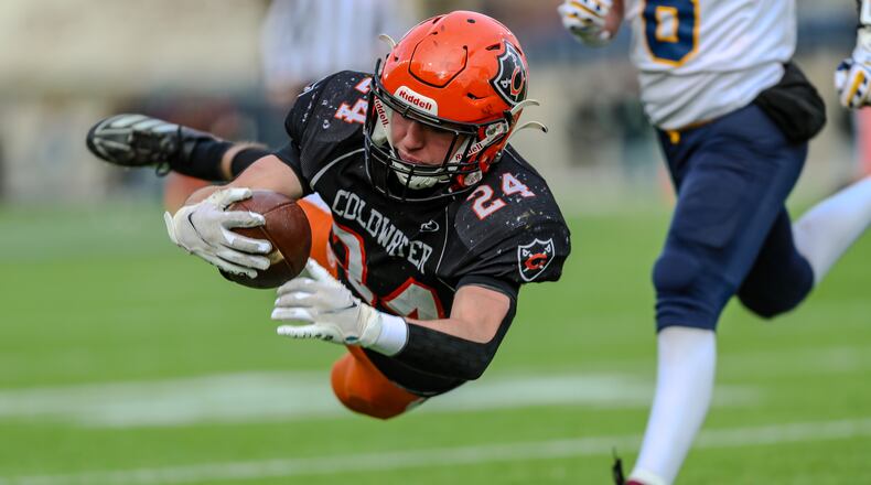Coldwater High School senior Miles Pottkotter dives into the end zone during the Division VI state championship game on Saturday morning at Tom Benson Hall of Fame Stadium in Canton. Michael Cooper/CONTRIBUTED
