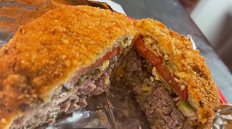 The fried cheeseburger now available at Myracles Bar & Grill weighs more than half a pound.