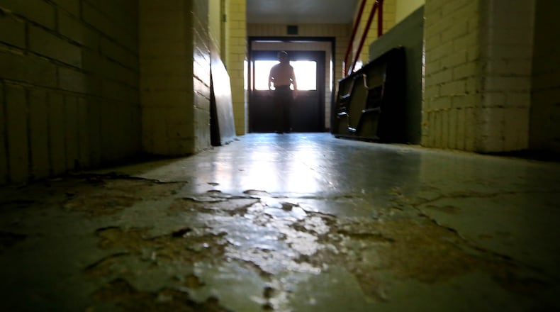 A deteriorated floor is shown in an area of Broadway School in Tipp City. The district is taking a new look at its facilities after a bond issue failed two years ago. FILE
