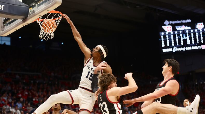 Dayton's DaRon Holmes II dunks against Massachusetts on Sunday, Jan. 7, 2024, at UD Arena. David Jablonski/Staff