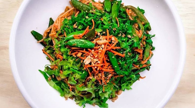 Spicy peanut ginger noodles with sauteed carrots and sugar snap peas in white wine, by Chef Da'Ves Malone of Sprouting Dreams LLC. SPROUTING DREAMS PHOTO
