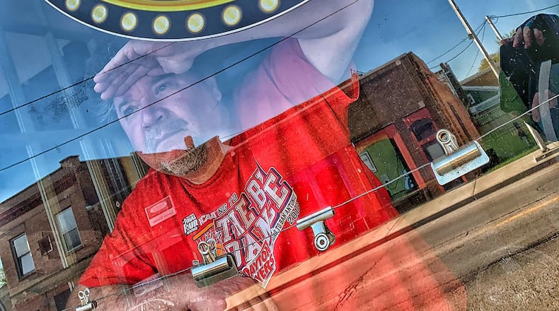 Speyrer in the front window of Mason City Limits