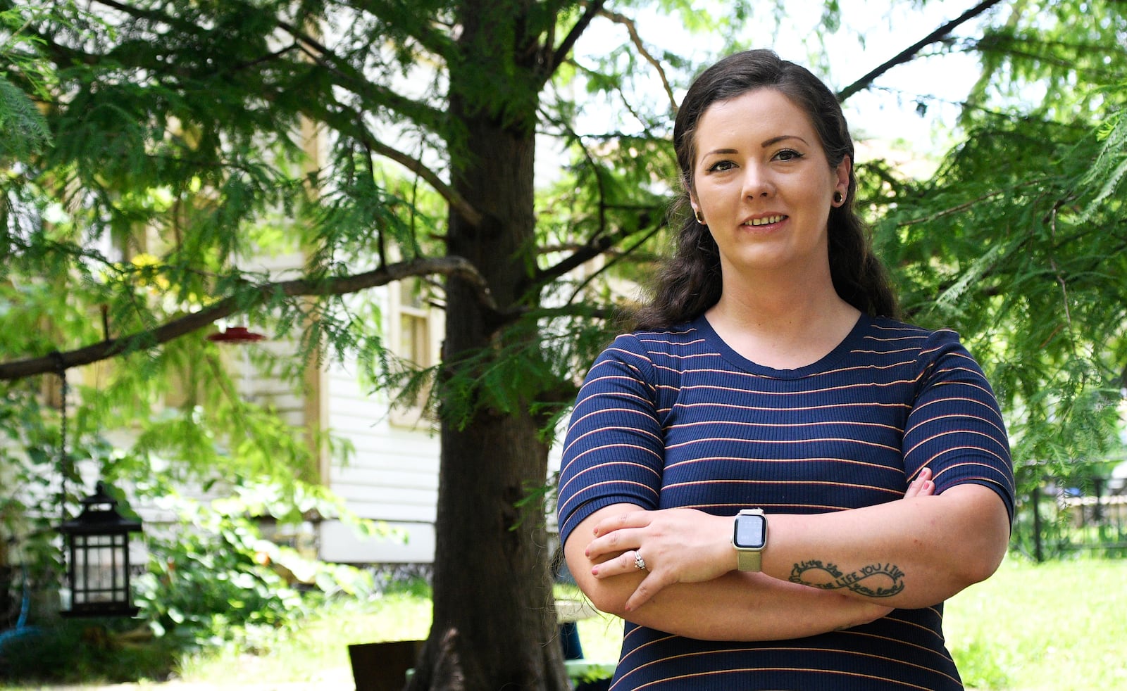Brittnee Nelson, who runs her own housecleaning business, poses for a portrait in her neighborhood in Shreveport, La., Monday, June 9, 2025. (AP Photo/Jill Pickett)