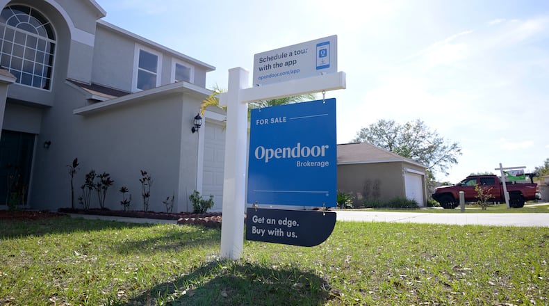 FILE - Real estate signs are posted outside homes for sale, Feb. 21, 2023, in Valrico, Fla. (AP Photo/Phelan M. Ebenhack, File)