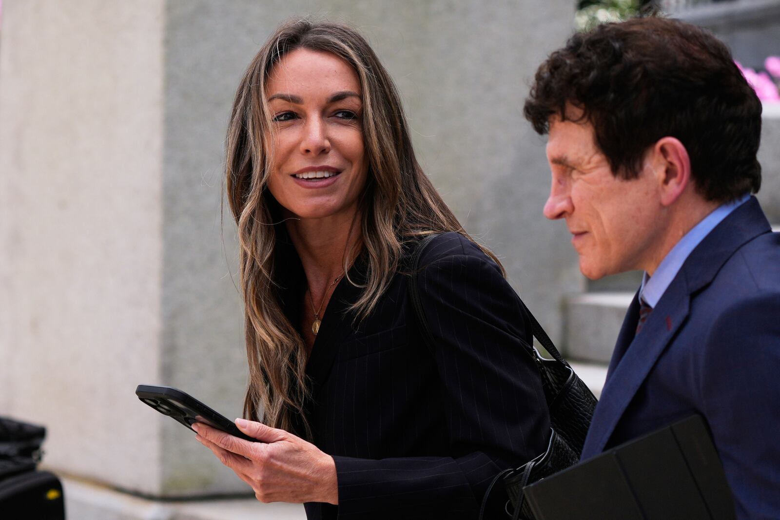 Karen Read returns to court following the lunch break with her defense attorney Robert Alessi at her trial at Norfolk Superior Court, Tuesday, April 22, 2025, in Dedham, Mass. (AP Photo/Charles Krupa)