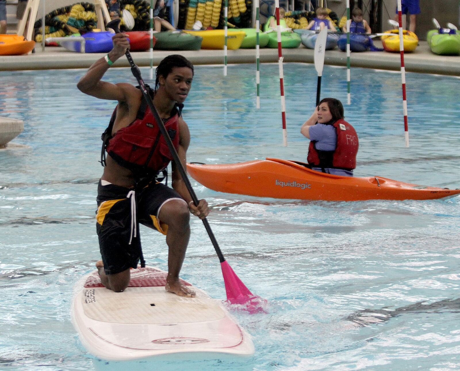 This Daytonian tries paddle surfing for the first time during a past Adventure Summit. CONTRIBUTED