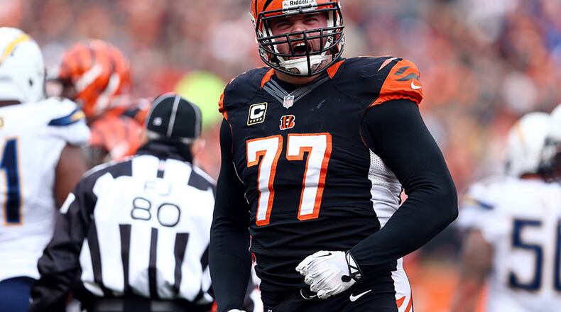 CINCINNATI, OH - JANUARY 05: Tackle Andrew Whitworth #77 of the Cincinnati Bengals reacts against the San Diego Chargers during a Wild Card Playoff game at Paul Brown Stadium on January 5, 2014 in Cincinnati, Ohio. (Photo by Andy Lyons/Getty Images)