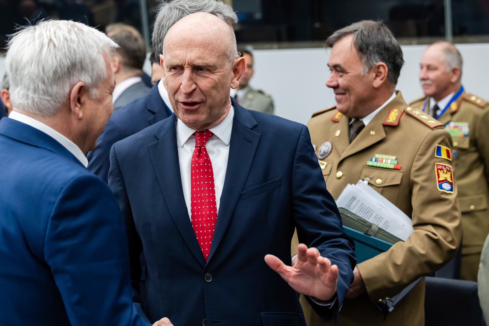 Britain's Defense Secretary John Healey, center, talks with Romania's Defense Minister Angel Tilvar as they arrive for a coalition of the willing defence ministers meeting at NATO headquarters in Brussels, Belgium, Thursday, April 10, 2025. (AP Photo/Geert Vanden Wijngaert)