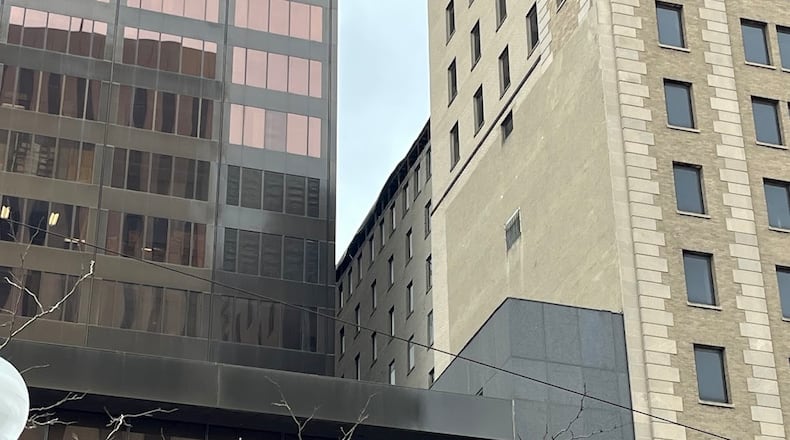 Part of the upper level of the building at 34 N. Main St. remained exposed Thursday. THOMAS GNAU/STAFF