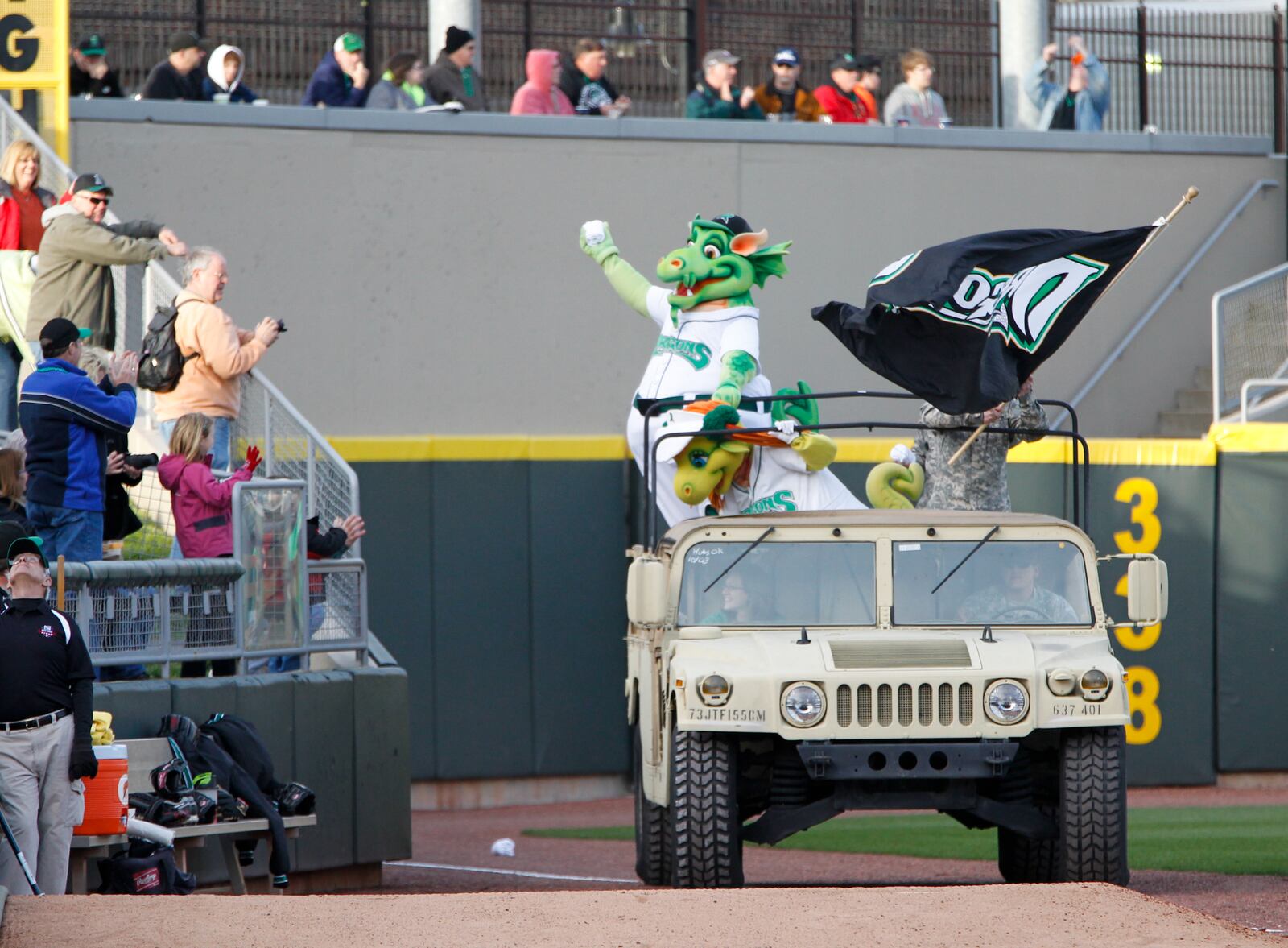 Dayton Dragons mascots Heater and Gem are driven around Fifth Third Field for the team's home opener on April 5, 2012. LISA POWELL / STAFF