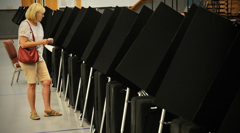 In this file photo, a Xenia resident votes Tuesday, Aug. 2, 2022 at the Xenia Grace Chapel in Greene County. MARSHALL GORBY \STAFF