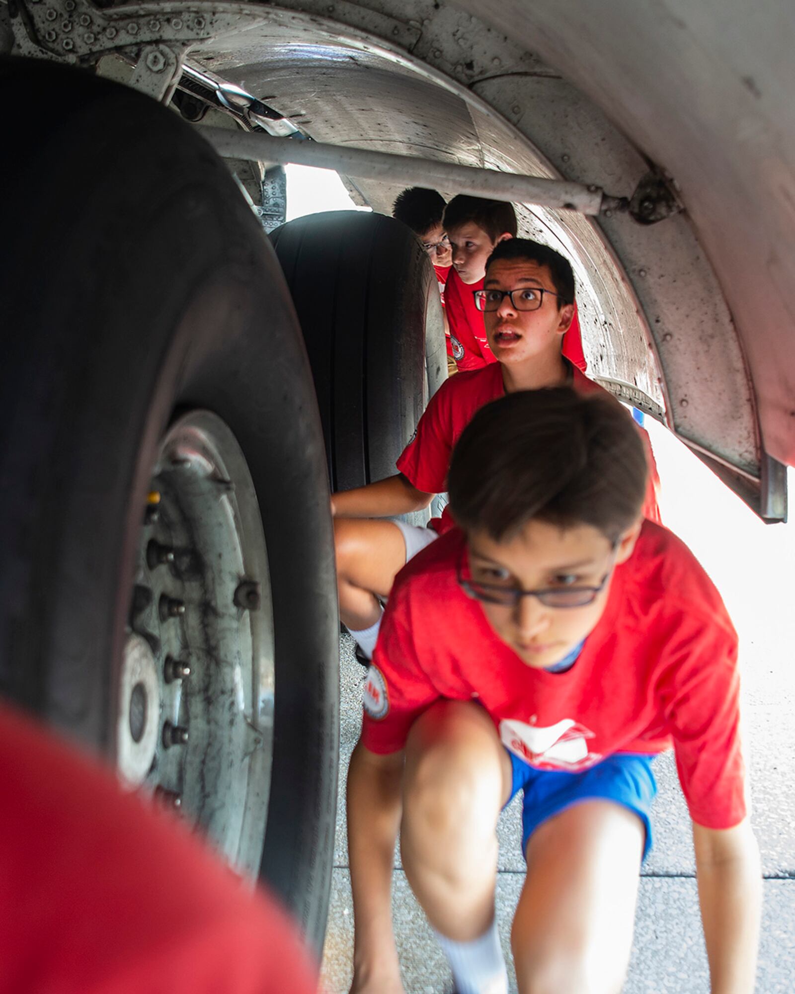 Air Camp participants get an up-close look at a C-17 Globemaster III aircraft’s landing gear and wheel well June 14 during a visit to Wright-Patterson Air Force Base. U.S. AIR FORCE PHOTO/R.J. ORIEZ