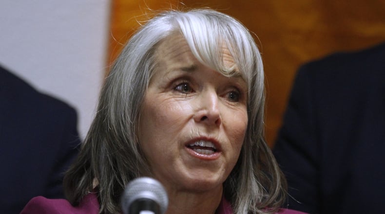 New Mexico Gov. Michelle Lujan Grisham speaks during a news conference, Tuesday, March 10, 2026, in Santa Fe, N.M., after signing legislation that bars federal immigration agents from election polling sites in New Mexico, in a step being considered by several other Democratic-led states. (AP Photo/Morgan Lee)