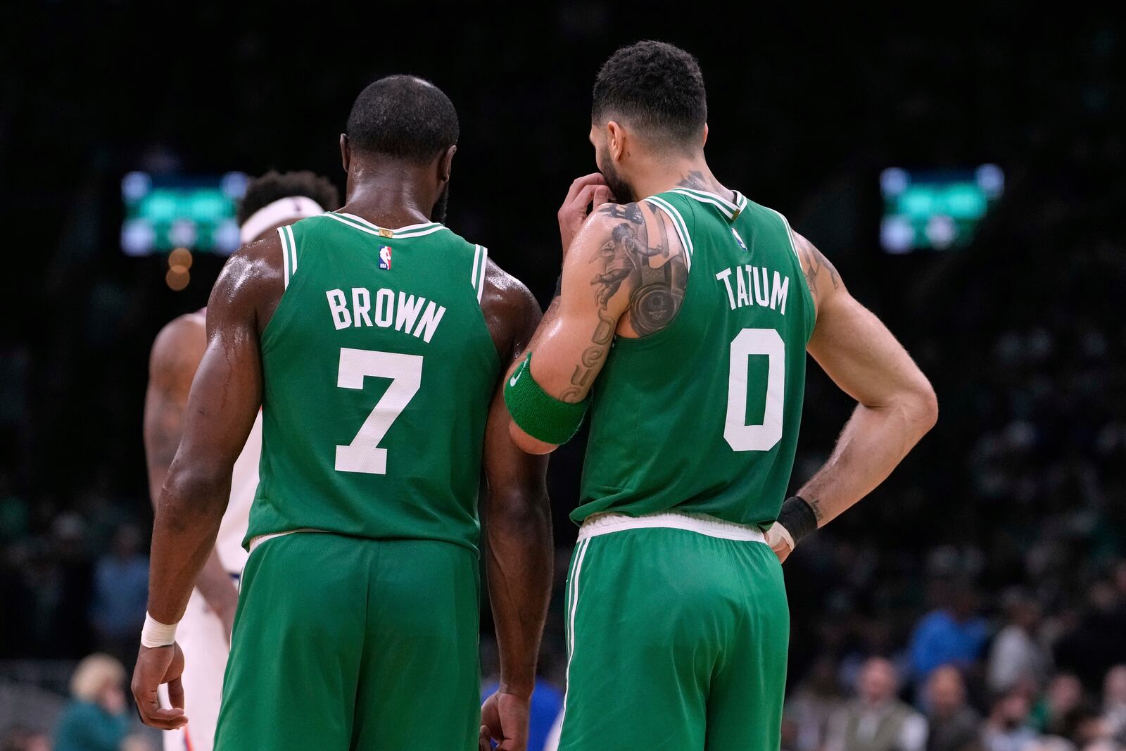 Boston Celtics forward Jayson Tatum (0) and guard Jaylen Brown (7) talk during the second half of Game 2 of an NBA basketball second-round playoff series against the New York Knicks, Wednesday, May 7, 2025, in Boston. (AP Photo/Charles Krupa)