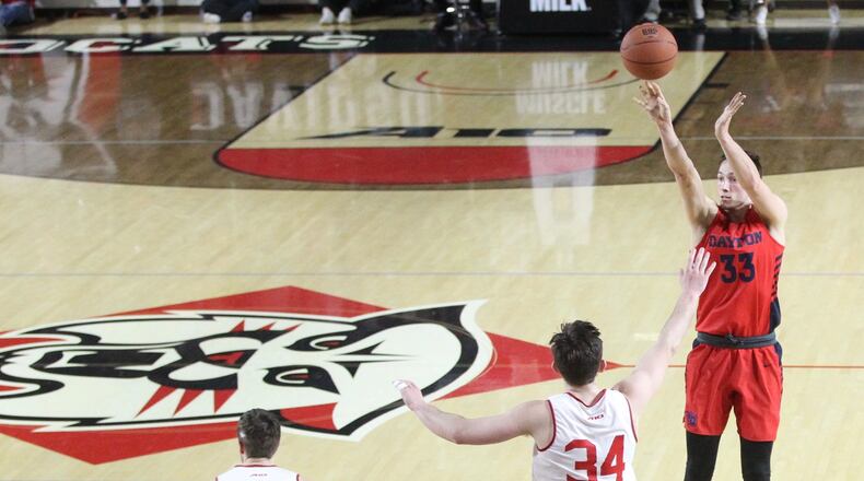 Dayton’s Ryan Mikesell makes a 3-pointer against Davidson on Tuesday, Feb. 19, 2019, at Belk Arena in Davidson, N.C. David Jablonski/Staff