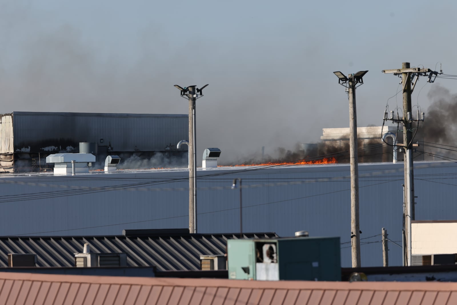 Firefighters continued to battle the remnants of a huge fire at the Fuyao Glass America plant in Moraine on Tuesday, March 24, 2026. The fire first started on Sunday and could be seen for miles originally. BRYANT BILLING / STAFF