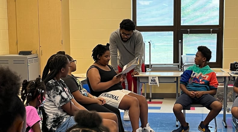 Students at Camp H.O.P.E. take turns reading a book related to their weekly theme. Camp H.O.P.E. is run by Omega CDC at Fairview Elementary and Edwin Joel Brown Middle School.