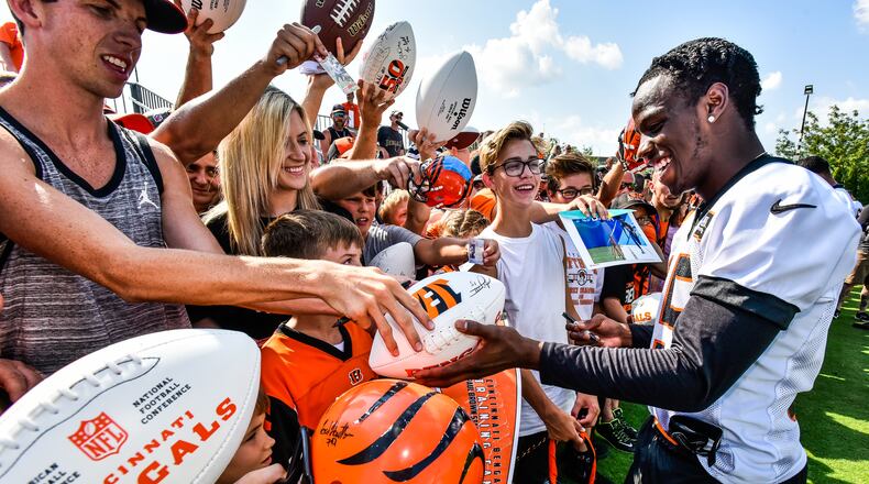 Wide receiver John Ross signs autographs during the first day of Cincinnati Bengals Training Camp Friday, July 28 at the practice fields beside Paul Brown Stadium in Cincinnati. NICK GRAHAM/STAFF