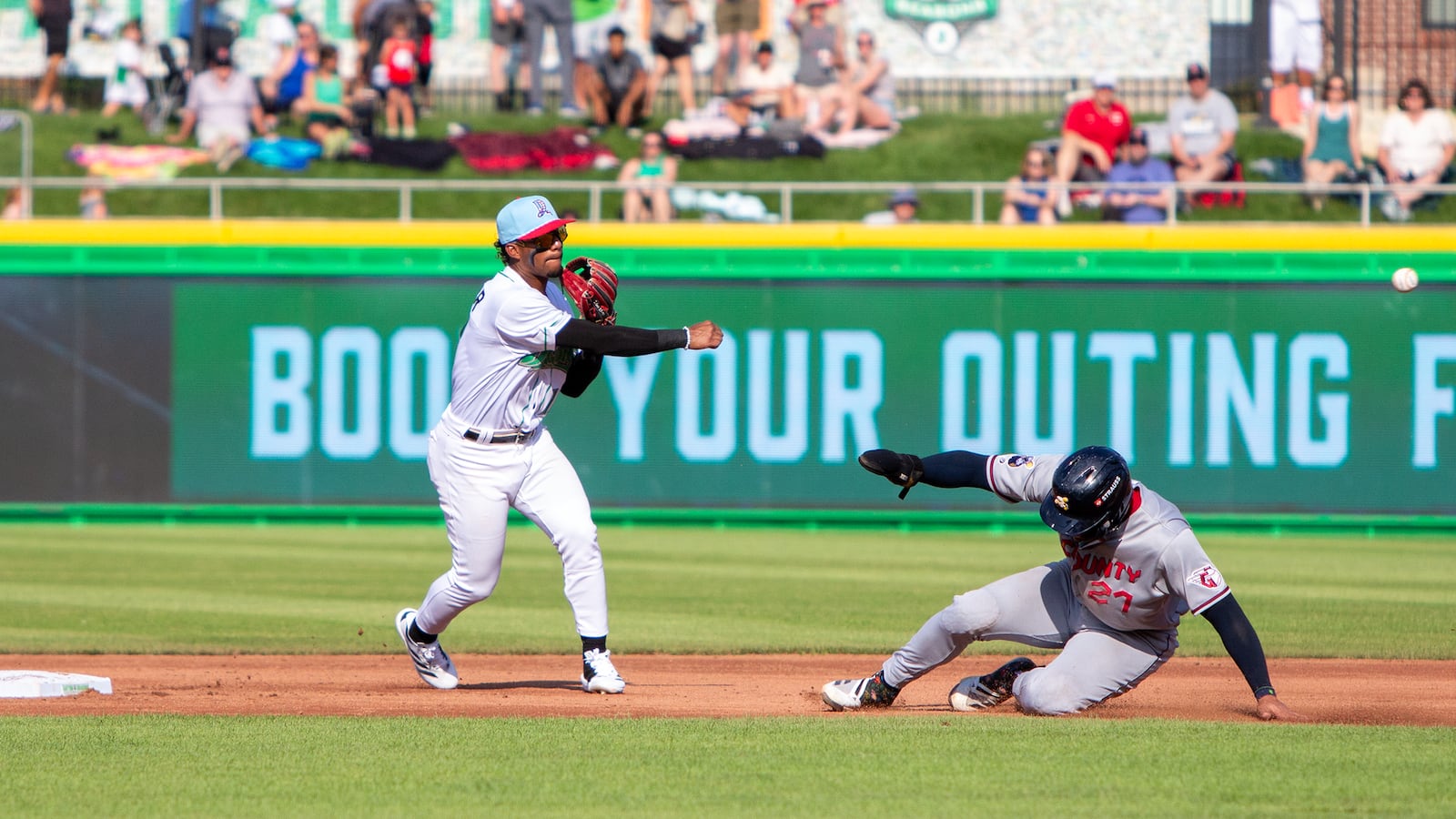 Dayton shortstop Leo Balcazar turns a double play in the third inning Thursday night at Day Air Ballpark. Jeff Gilbert/CONTRIBUTED