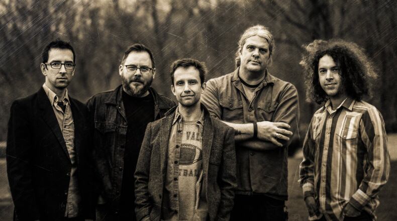 Shrug, (left to right) Ken Hall, Dan Stahl, Bryan Lakatos, Tod Weidner and Tim Pritchard, celebrates the release of “Age of Ashes” at the “Old” Yellow Cab. Bldg. in Dayton on Saturday, June 11. CONTRIBUTED