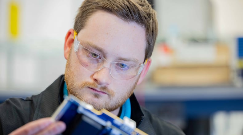 Jonathan Hoopes, GE Aerospace electronic hardware lead engineer, works on aircraft electrical power generation components Electrical Power Integrated Systems Center, or
EPISCenter in Dayton. GE Aerospace’s investment into its Dayton area facilities in the past two years totals $53.7 million. CONTRIBUTED