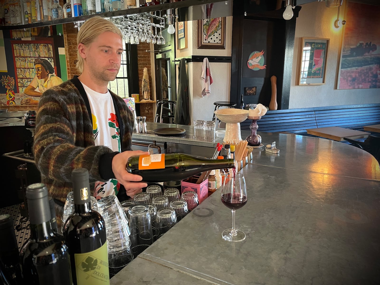 The Silver Slipper is located at 1105 Wayne Ave. in Dayton. Pictured is Simon Gifford, who owns the wine bar with Lorelei Fink. NATALIE JONES/STAFF