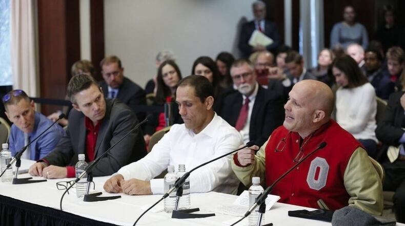 Victims of Dr. Richard Strauss, from right, Michael DiSabato, Mike Schyck, Brian Garrett and Stephen Snyder Hill during an Ohio State University Board of Trustees meeting at the Longaberger Alumni House on Nov. 16, 2018
