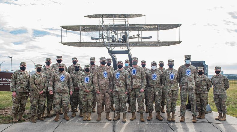 Wright-Patterson Air Force Base’s chief master sergeant-selects gather for a group photo Dec. 9 in front of the Wright Flyer sculpture near Gate 1 on Area B. U.S. AIR FORCE PHOTO/WESLEY FARNSWORTH
