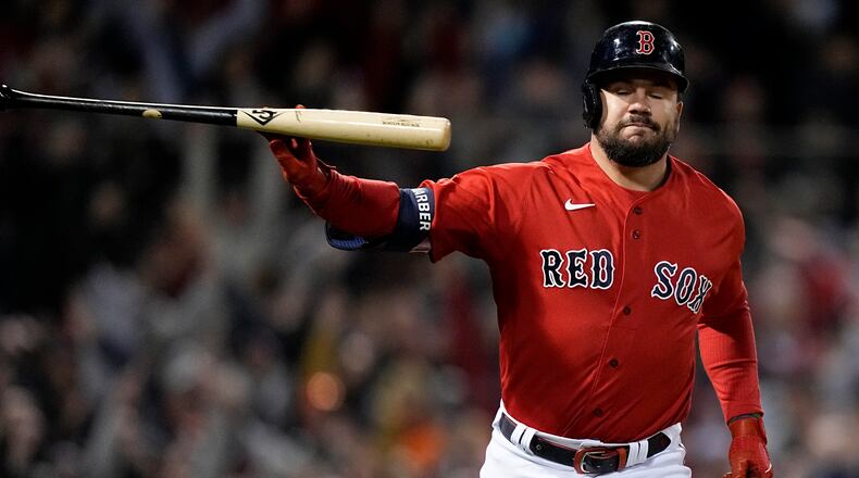Boston Red Sox's Kyle Schwarber tosses his bat after a grand slam home run against the Houston Astros during the second inning in Game 3 of baseball's American League Championship Series Monday, Oct. 18, 2021, in Boston. (AP Photo/David J. Phillip)