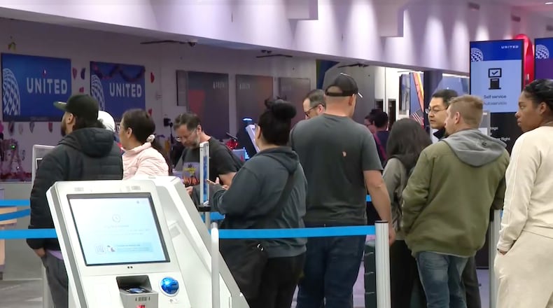 Passengers wait in line at the El Paso International Airport after all flights were grounded on Wednesday, Feb. 11, 2026. (KFOX via AP)