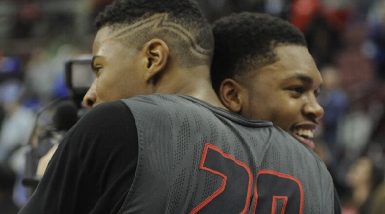 Wayne’s Xeyrius Williams (left) celebrates with Trey Landers. Wayne defeated Westerville South 65-57 to win the boys high school basketball Division I state championship at OSU’s Schottenstein Center on Saturday, March 28, 2015. MARC PENDLETON / STAFF