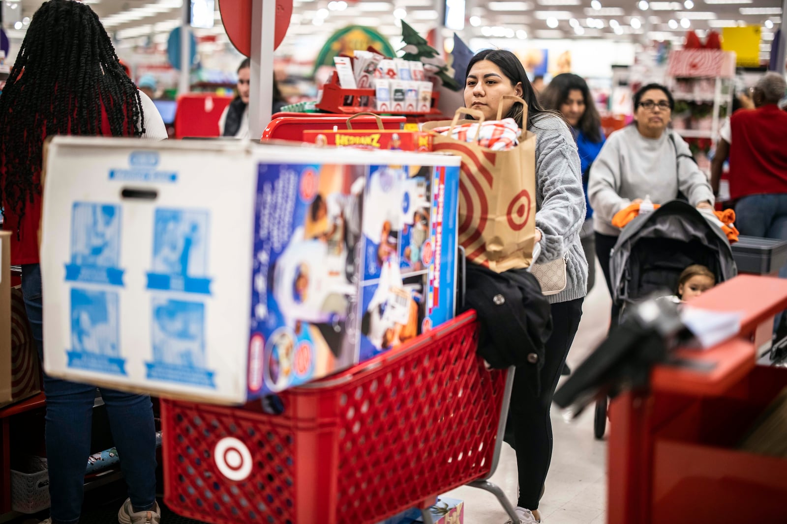 Shoppers leave a Target store with their purchases in Albany, N.Y., on Friday, Nov. 29, 2024. Black Friday marks the unofficial start of the holiday shopping season, a make-or-break period for many retailers. (Dave Sanders/The New York Times)