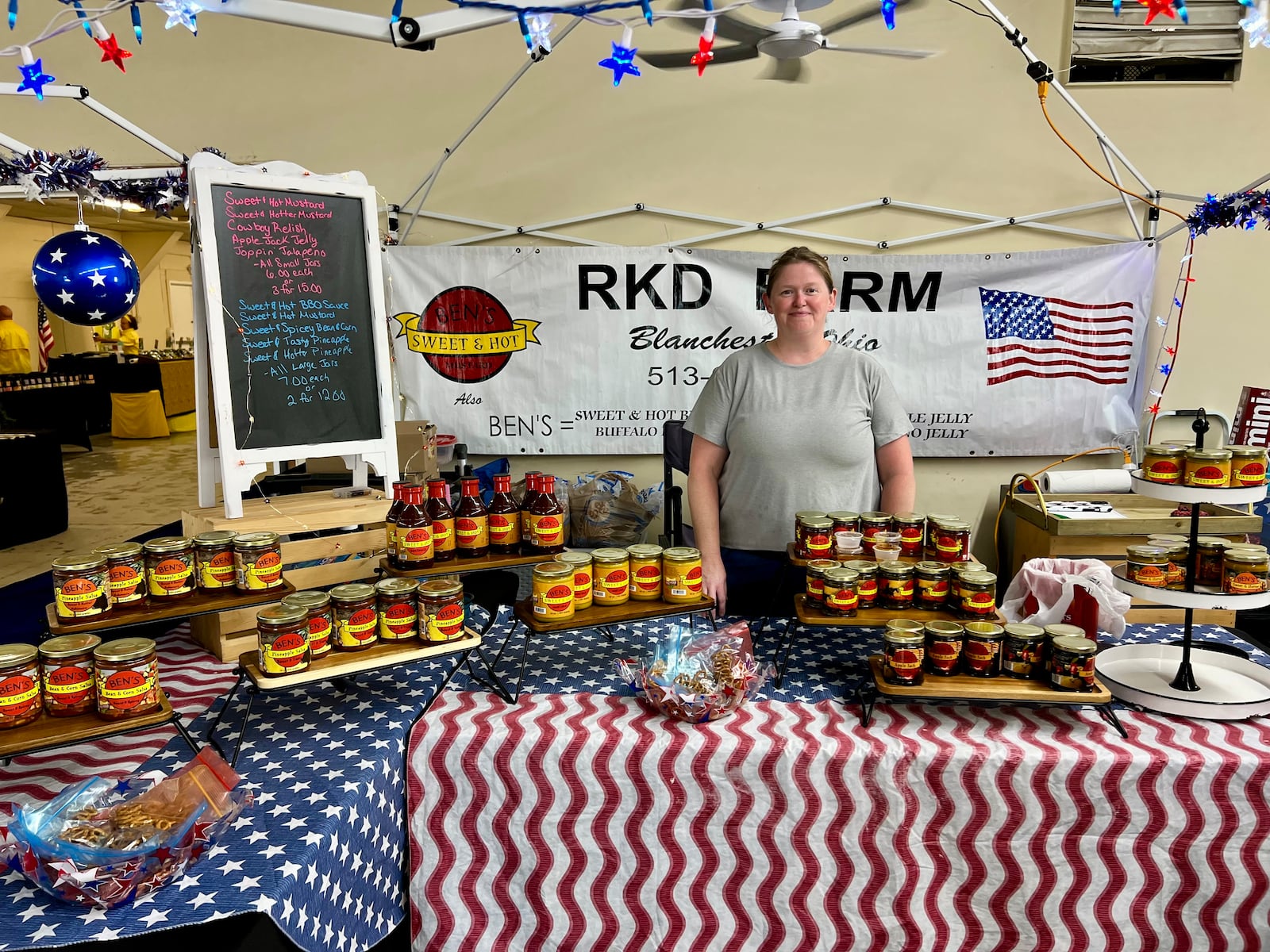 Kim Davis stands near her RKD Farm booth at the Greene County Fair in Xenia. AIMEE HANCOCK / STAFF