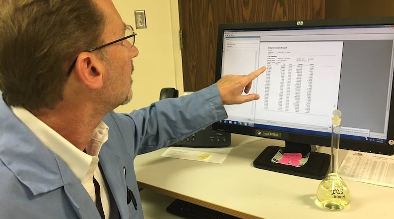 Tony Miley, senior analyst at Montgomery County’s soil and water conservation laboratory, shows a list of minerals and their levels found in a sample. RICHARD WILSON/STAFF