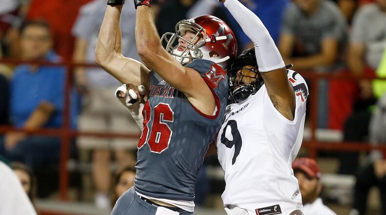 OXFORD, OH - SEPTEMBER 16: Luke Mayock #86 of the Miami Ohio Redhawks catches a touchdown defended by Linden Stephens #9 of the Cincinnati Bearcats during the first half at Yager Stadium on September 16, 2017 in Oxford, Ohio. (Photo by Michael Reaves/Getty Images)