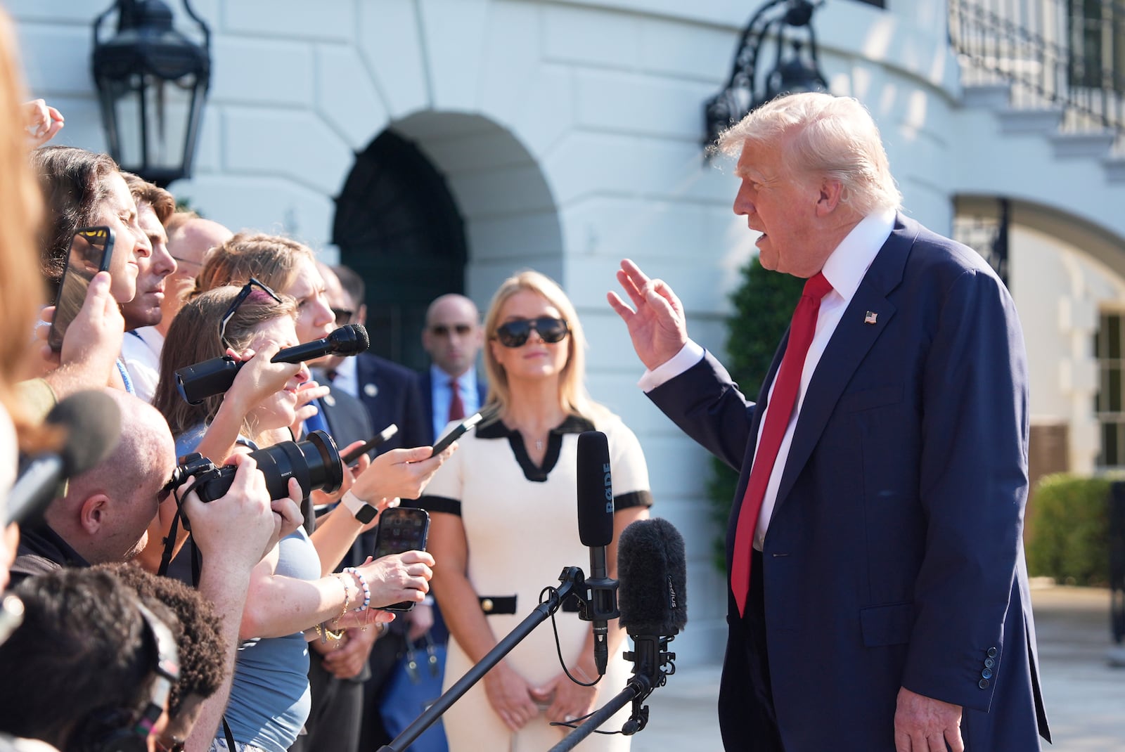 President Donald Trump speaks with reporters before departing on Marine One from the South Lawn of the White House, Friday, July 25, 2025, in Washington. The President is traveling to Scotland. (AP Photo/Alex Brandon)