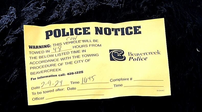 A notice on a cow that perished along I-675 on Friday. MARSHALL GORBY\STAFF