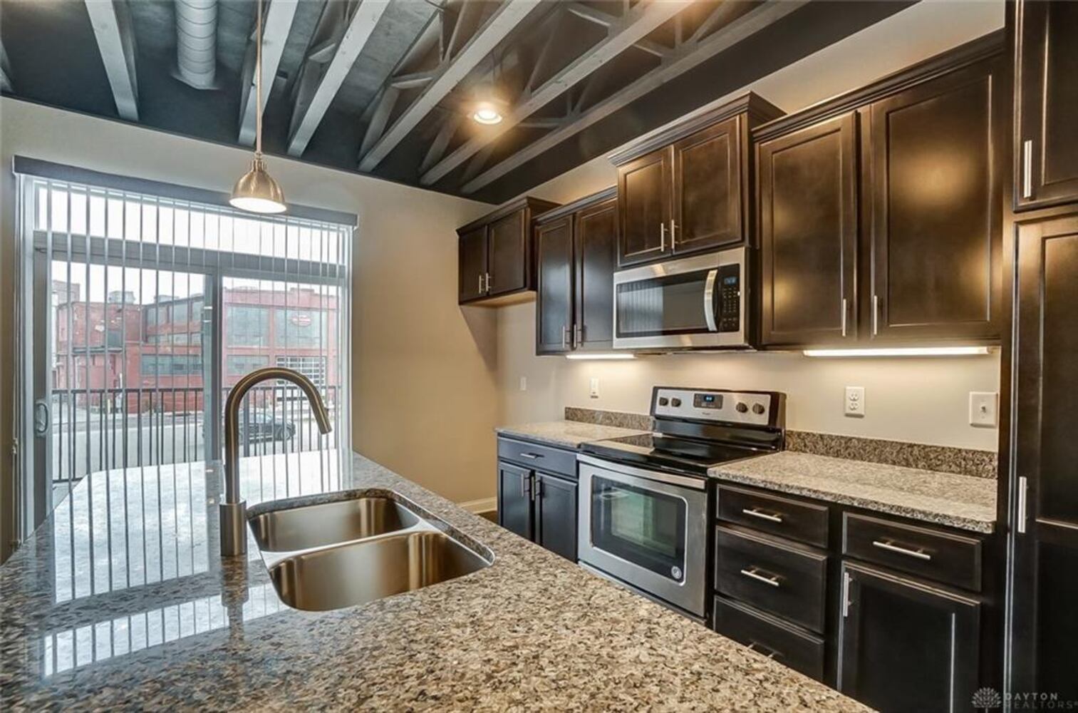 PHOTOS: Downtown Dayton condo with rooftop patio listed for nearly $500K