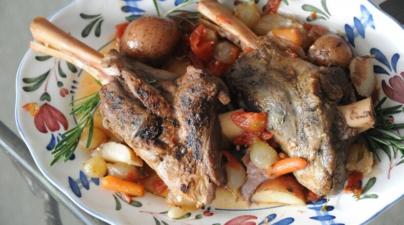 Braised lamb shanks with pearl onions and new potatoes. (Lake Fong/Pittsburgh Post-Gazette/TNS)