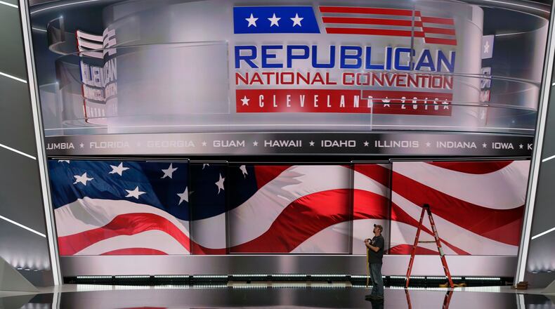 A worker stands on stage as preparations continue for the Republican National Convention, Friday, July 15, 2016, at the Quicken Loans Arena in Cleveland. (AP Photo/Alex Brandon)