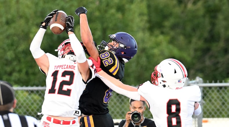 Tippecanoe High School senior Max Deckard (12) and senior Jackson Robbins (8) defend a pass against Bellbrook's Noah Barrios during their game on Friday, Aug. 22 at Miami Valley South Stadium. Tippecanoe won 21-0. NICK FALZERANO / CONTRIBUTED PHOTO