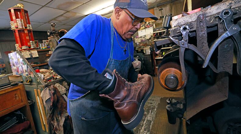 Clifford Borden, owner of Pritchet Shoe Service, has been repairing shoes for over 30 years and took over the business when "Mr. Pritchet" retired. BILL LACKEY/STAFF