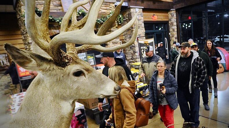 Black Friday shoppers looking for good deals. Pour into the Cabela’s in Centerville as soon as the doors open at 5 o’clock Friday morning November 25, 2022. MARSHALL GORBY \STAFF