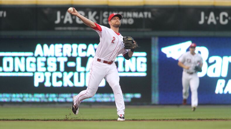 Reds shortstop Zack Cozart throws to first for an out against the Yankees on Tuesday, May 9, 2017, at Great American Ball Park in Cincinnati.